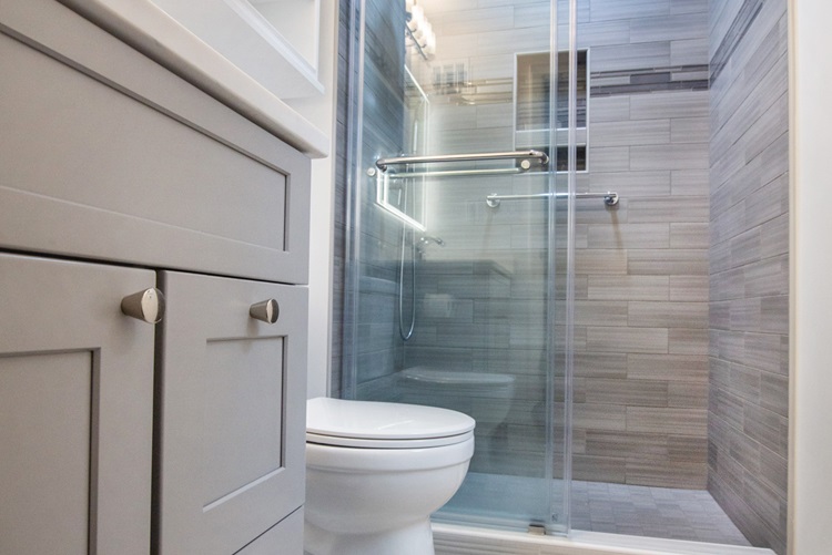 Bathroom With Gray Cabinet White Countertop Backlit Mirror Gray Tiled Shower Glass Door Remodeled By Aladdin Carpet Gaithersburg Md