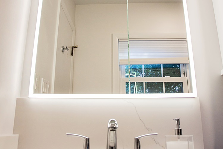 Modern Bathroom With Illuminated Mirror White Countertop Silver Faucet Remodeled By Aladdin Carpet Gaithersburg Md