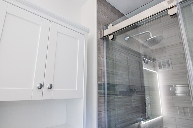 White Cabinet Chrome Handles Glass Shower Door Gray Tile Wall Showerhead Remodeled By Aladdin Carpet Gaithersburg Md