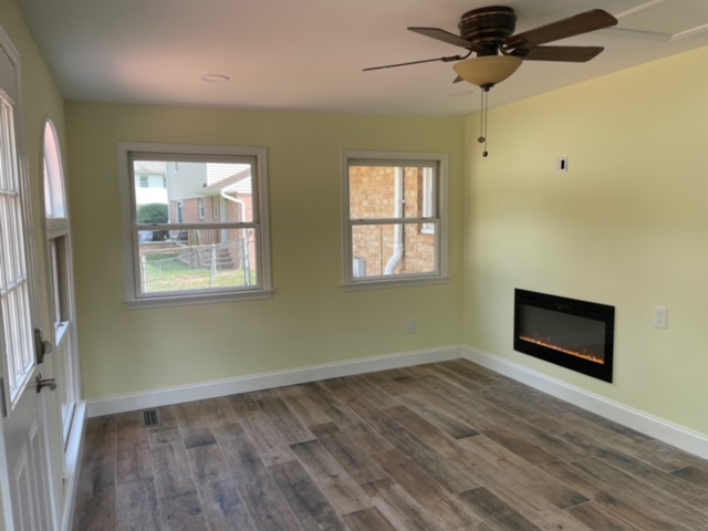 Sun room with electric fire place Lea ceramiche tile onley MD